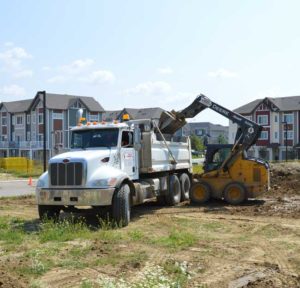 Superior Trenching Dump Truck and Bobcat - careers in trenching & excavation